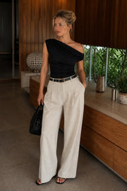 Black Blouse with Waist Cinching and Asymmetrical Shoulder Detail